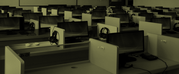 Empty cubicles with computer monitors