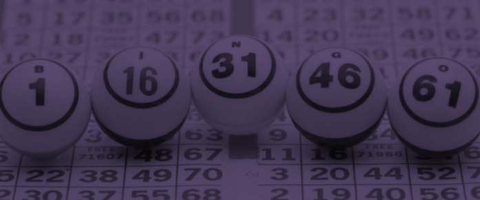 Bingo cards and calling balls spelling B-I-N-G-O